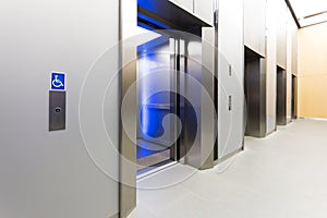 disabled signage, Modern steel elevator opened cabins in a business lobby or Hotel, Store, interior, office,perspective wide photo