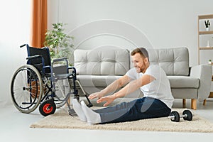 Disabled sportsman doing stretching and exercises on wheelchair background. Life of a disabled person.
