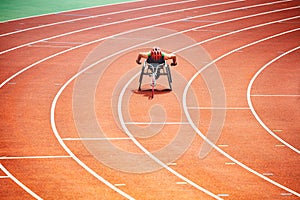 Disabled sportsman on sport wheelchair bike track