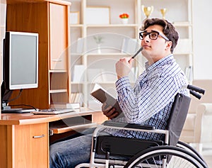 Disabled student studying at home on wheelchair