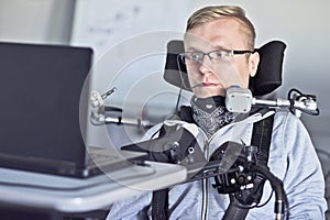 Disabled student working with his computer.