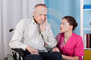 Disabled talking with a nurse and grieves