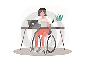 Disabled wheelchair invalid woman working, studiyng on the laptop in comfortable workplace.