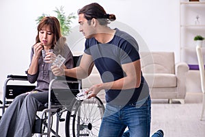 Disabled wife and young husband at home