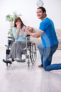 Disabled wife and young husband at home