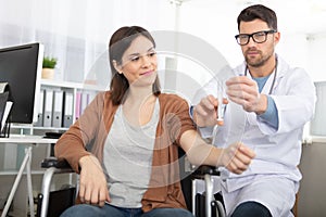 disabled woman getting vaccine in clinic