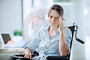 Disabled woman with headache