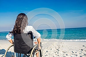 Disabled woman looking at the ocean