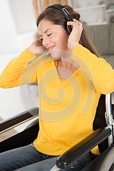 disabled woman in rapture listening to headphones