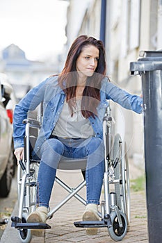 Disabled woman rides wheelchair photo