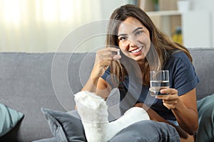 Disabled woman showing a painkiller pill