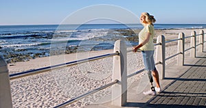 Disabled woman standing in the beach 4k