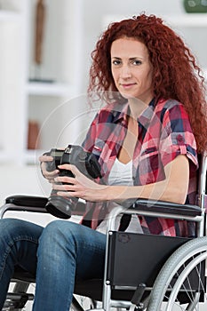 Disabled woman taking pictures with dslr camera