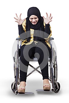 Disabled woman on wheelchair and looks frustrated