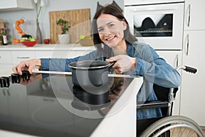 disabled woman in wheelchair preparing dinner