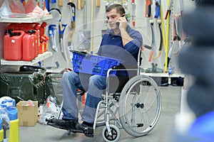 Disabled worker buying tools in store