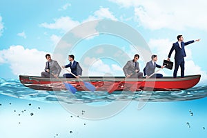 Disagreement concept with businessmen rowing in different direct photo