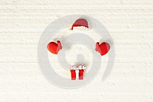 Disappeared santa,christmas mittens and hat with gift on white background, new year concept