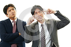 Disappointed Asian businessmen