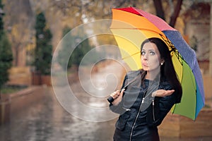 Disappointed Autumn Girl Holding Rainbow Umbrella
