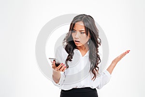 Disappointed confused asian businesswoman using smartphone photo