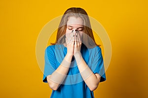 Disappointed dejected woman covering her face with hands being tired and exhausted. Desperate girl having depression