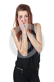 Disappointed girl holding her face with hands