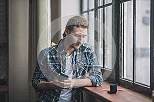 Disappointed man thinking of making a proposal to his girlfriend.