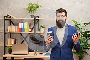 Disappointed manager hold empty disposable coffee cup during office break, takeaway