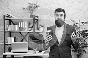 Disappointed manager hold empty disposable coffee cup during office break, takeaway