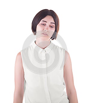 A disappointed office worker. An expressive female isolated on a white background. A disgusted brunette lady in casual clothes.