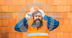 Disappointed Sad Caucasian Contractor Worker Facing. Legal Problems. Bond, Insurance, Work Injury Concept Photo. Bearded