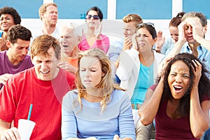 Disappointed Spectators At Outdoor Sports Event