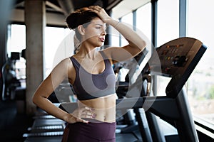 Disappointed tired woman trying to reach fitness goals by endurance and stamina training