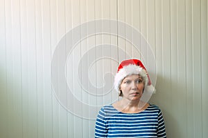 Disappointed woman with Christmas Santa Claus hat