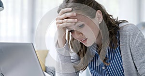 Disappointed woman reading a rejection letter