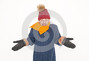 Disappointed young handsome man wearing in red hat and blue pullover feeling cold on white background