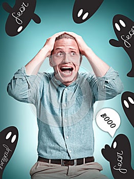 The disappointed young man over blue background