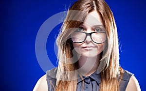 Disappointed young woman with nerd glasses, strict girl