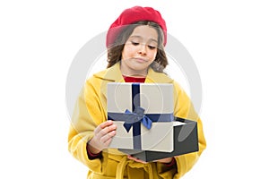 Disappointing purchase. Child stylish hold open gift box. Girl cute little lady coat and beret throws out gift. Spring