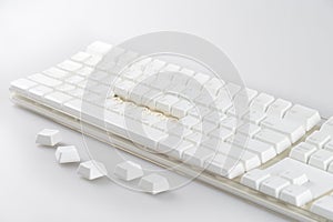 Disassemble a dirty white computer keyboard