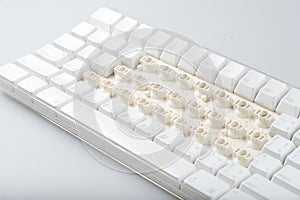 Disassemble a dirty white computer keyboard