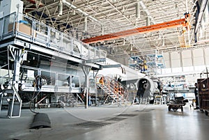 Disassembled airplane for repair and modernization in jet hangar