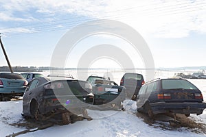 Disassembled cars on a car dump are on sale for spare parts