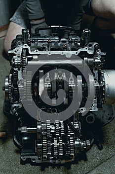 Disassembled fast motorcycle engine with visible Transmission and locking valve