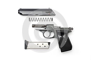 Disassembled gun on a white background