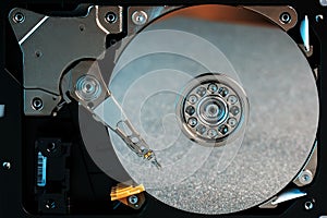 Disassembled hard drive from the computer, hdd with mirror effect Opened hard drive from the computer hdd with mirror effects Part