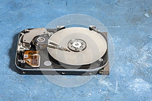 Disassembled hard drive from the computer, hdd with mirror effect. Opened hard drive from the computer hdd with mirror effects.