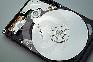 Disassembled hard drive from the computer hdd with mirror effects. Part of computer