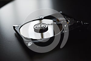 Disassembled hard drive from the computer (hdd) with mirror effects. Part of computer (pc, laptop)